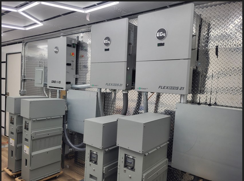 Interior of the Power Station container: EG4 GridBOSS and two FlexBOSS 21 hybrid inverters with storage units